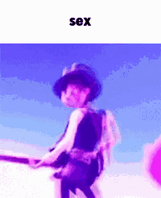 a picture of a person holding a gun with the word sex below it