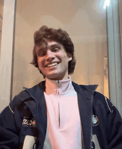 a man wearing a jacket that says teco on the back