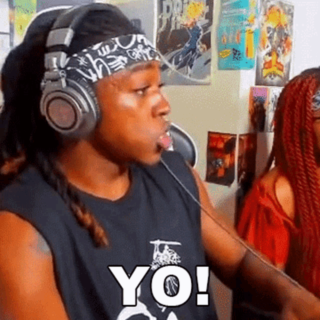 a man wearing headphones and a bandana with the word yo on it