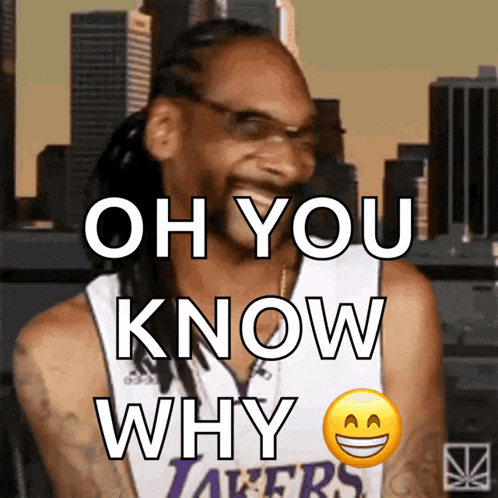 snoop dogg is wearing a lakers jersey and laughing