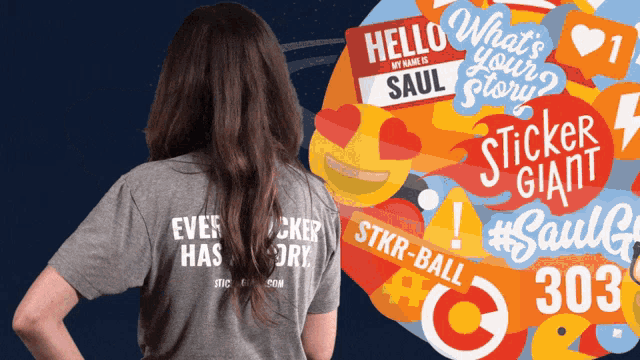 a woman wearing a grey shirt that says ever has a story on the back