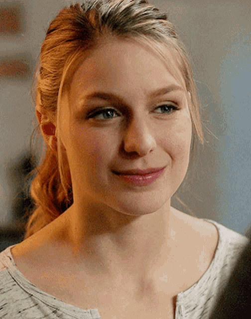 a close up of a woman 's face with her eyes closed