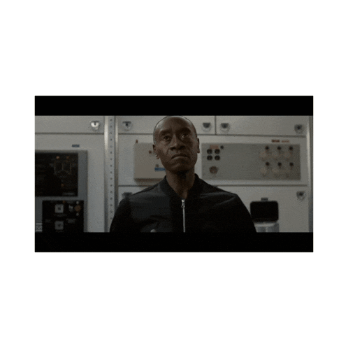 a man in a black jacket is making a funny face