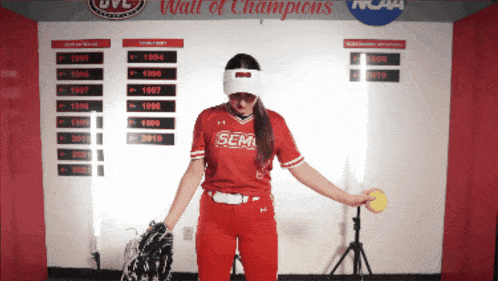 a woman in a red shirt that says sem on it
