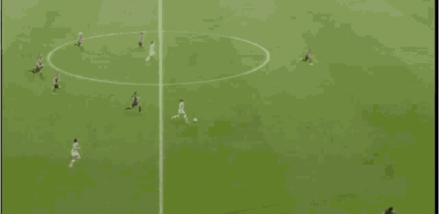 a soccer game is being played in front of a banner that says " the fa player "
