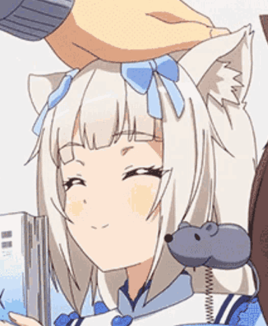 a person is petting a cat girl 's head with a mouse on her shoulder .