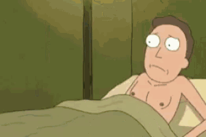 a cartoon character is laying in bed with his mouth open and his arm outstretched .