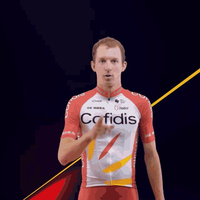 a man wearing a red and white cofidis shirt