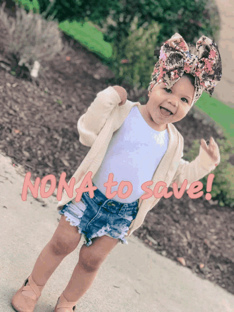a little girl wearing shorts and a cardigan stands in front of a sign that says " nona to save "