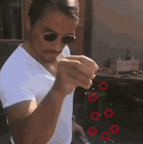 a man wearing sunglasses and a white shirt has red hexagons on his wrist