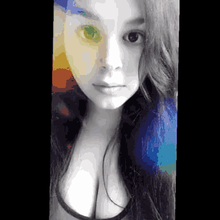 a black and white photo of a woman 's face with a rainbow background