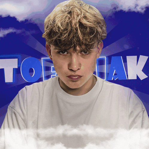 a young man in a white shirt stands in front of a blue background that says tobrak