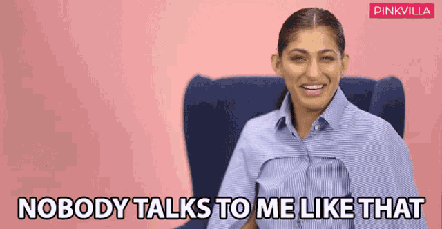a woman is sitting in a chair with the words nobody talks to me like that behind her