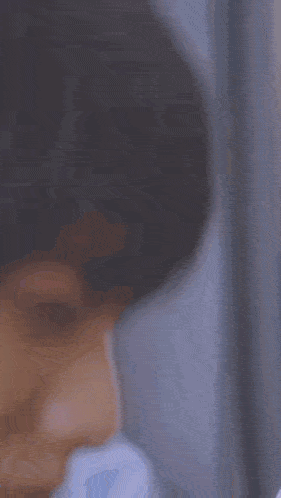 a close up of a person 's face with tears running down their cheeks .