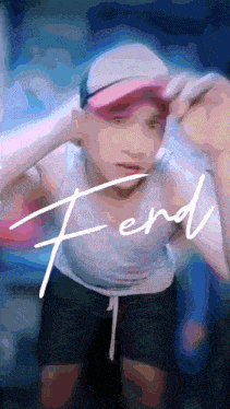 a man wearing a white tank top and black shorts is standing in front of a sign that says ferd