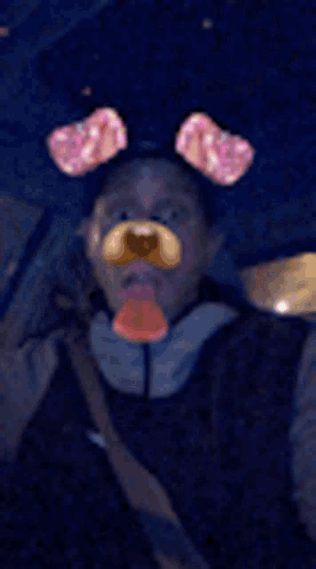 a man is wearing a teddy bear mask and a tie .