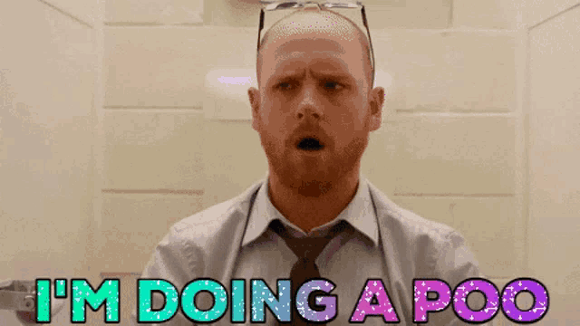 a man in a shirt and tie says " i 'm doing a poo "