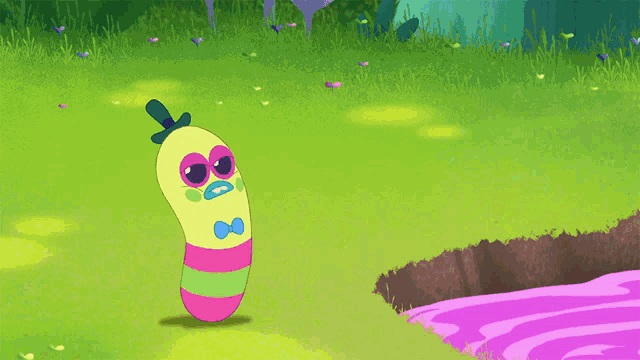 a colorful cartoon character is standing in the grass with a green liquid coming out of its mouth