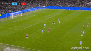 a soccer player is running on the field with the score 1-1