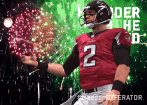 a football player with the number 2 on his jersey stands in front of a fireworks display