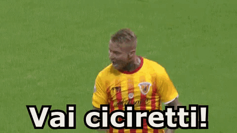 two soccer players hugging each other with the words vai ciciretti in the upper right corner