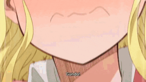a blonde anime girl is sitting on a bed with her arms outstretched and screaming .