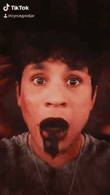 a man is making a funny face with tiktok written on the bottom right corner