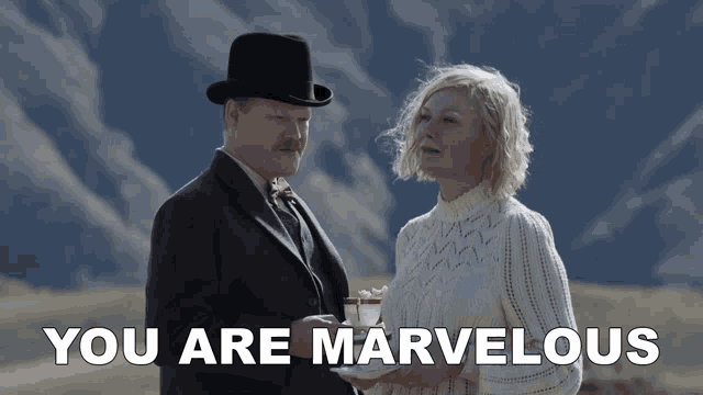 a man and a woman standing next to each other with the words " you are marvelous " below them