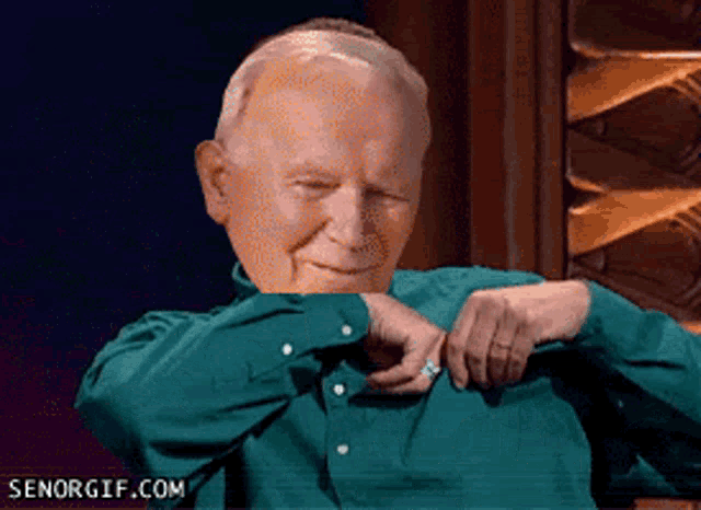 an older man in a green shirt has a senorgif.com logo on the bottom right