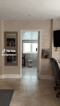 a tiktok video of a room with a chair and a book titled la vogue