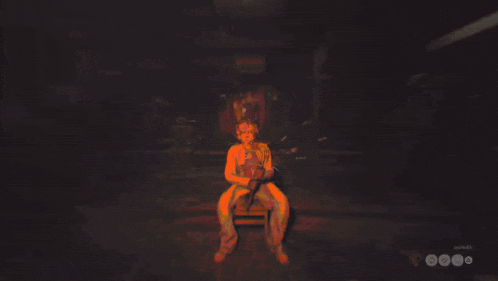a person is sitting in a chair in a dark room with a red light behind them that says escape