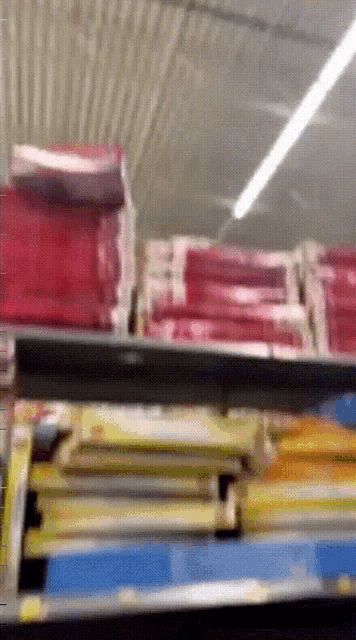 a stack of books on a shelf in a library