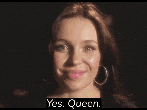 a woman with hoop earrings is smiling with the words yes queen below her