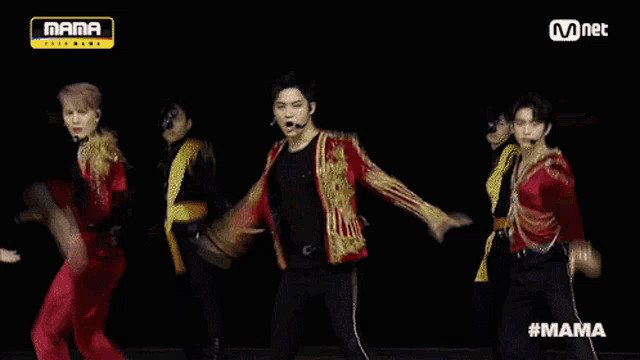 a group of men are dancing on a stage with the words mama on the bottom