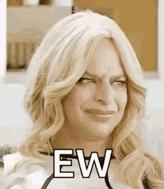 a man in a wig is making a funny face and saying `` ew '' .