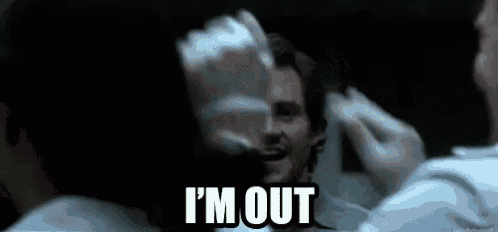 a man is looking at himself in a mirror and saying i 'm out .