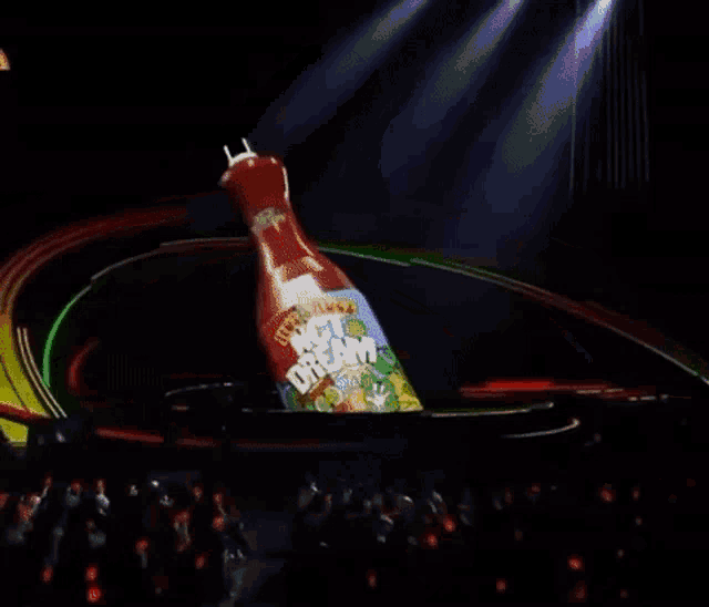 a bottle of hot sauce is being thrown on a table