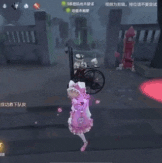 a girl in a pink dress is standing in front of a man in a wheelchair