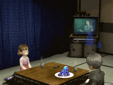 a man and a girl are sitting at a table in front of a tv