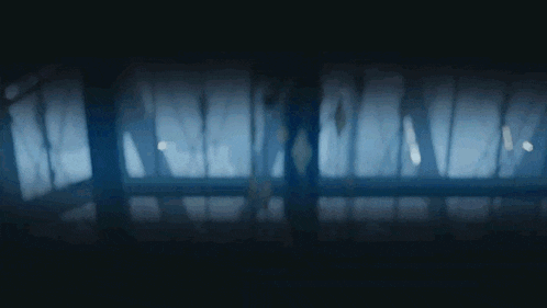 a blurry picture of a dark room with a few lights on