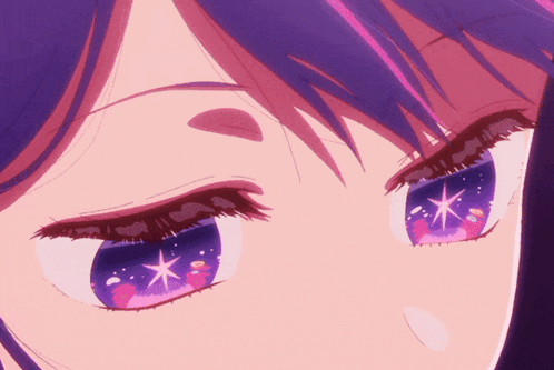 a close up of a girl 's eyes with a star in the middle