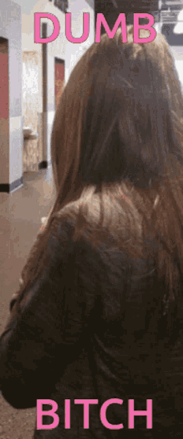 a picture of a woman with the words " dumb bitch " above her