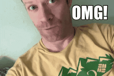 a man wearing a yellow shirt with the word omg written on it