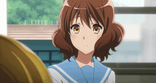 a girl with brown hair and a blue and white uniform