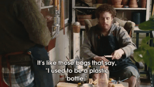 a man is sitting at a table talking to another man and says it 's like those bags