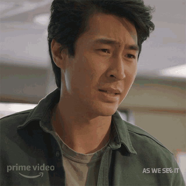 a man 's face is shown in a prime video ad for as we see it