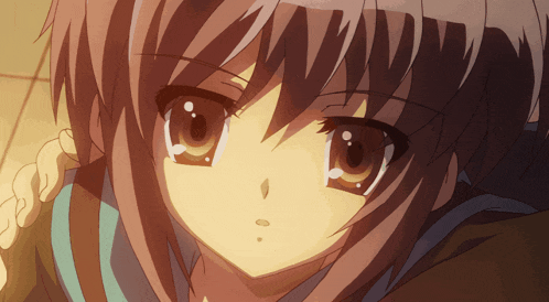 a close up of a girl 's face with a tear coming out of her eyes