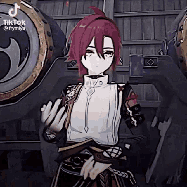 a girl with red hair and a white shirt is standing in front of a large object .