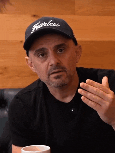 a man wearing a black hat that says fearless on it