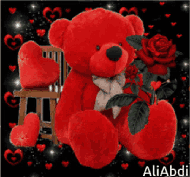 a red teddy bear is sitting next to a chair with red hearts on it